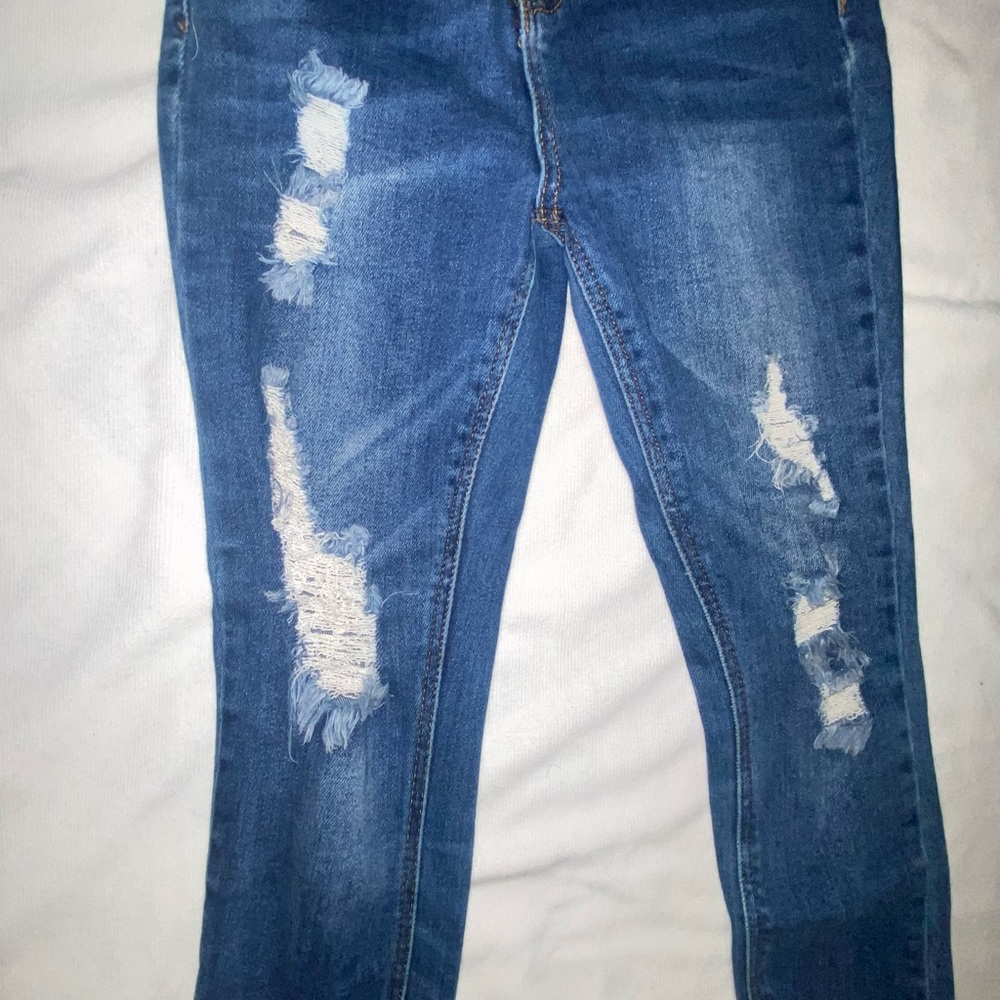 Size 24 skinny ripped jeans .